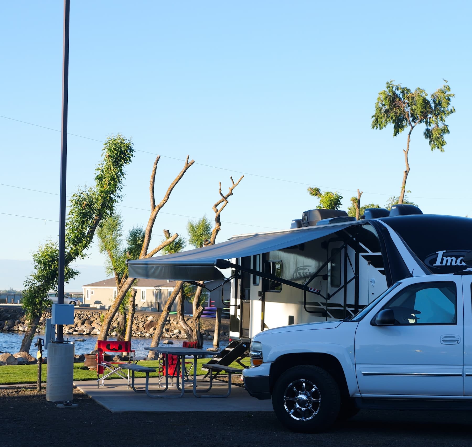 A camper set up at a waterfront site at MarDon Resort