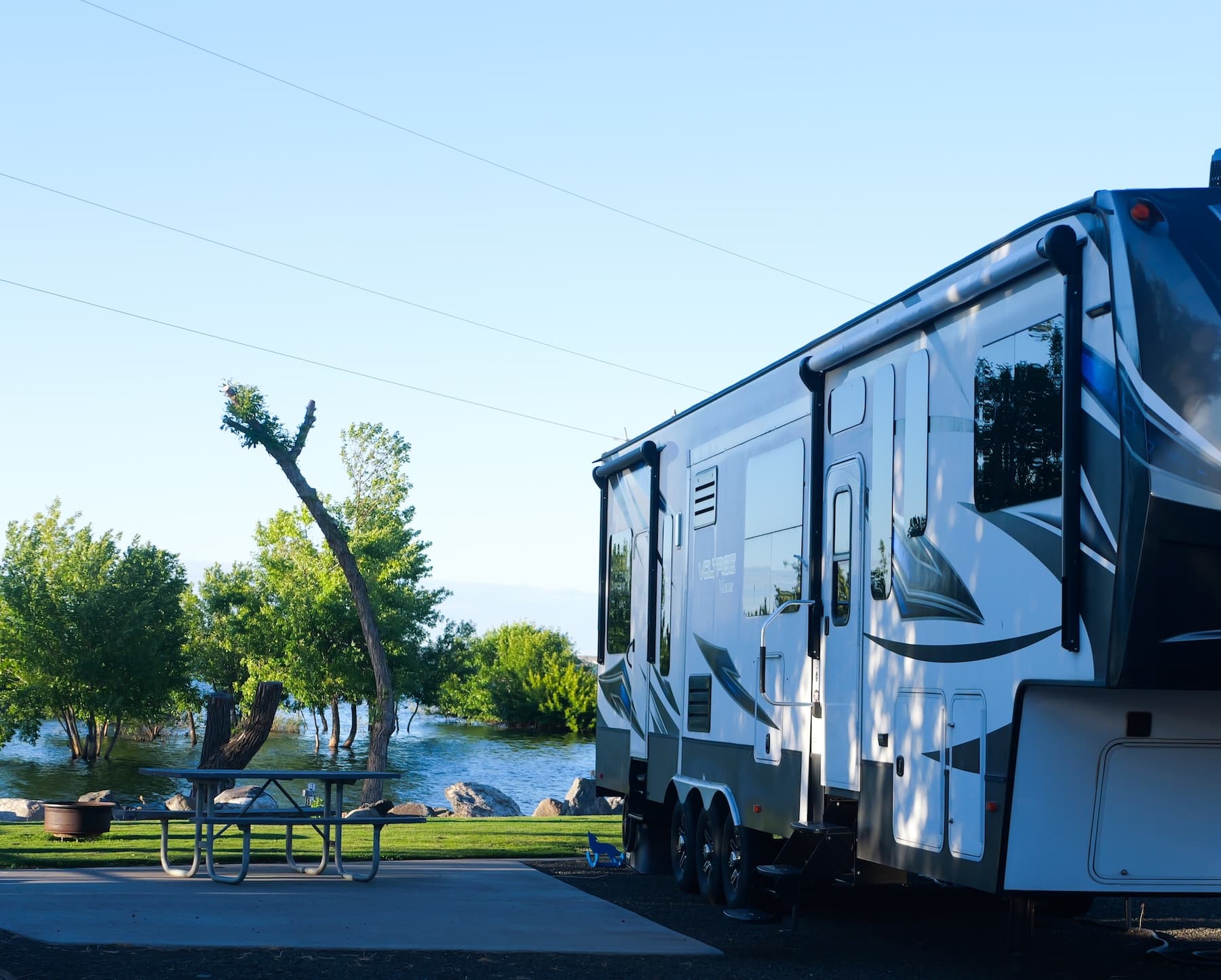 A big-rig RV parked at a waterfront site on Potholes Reservoir