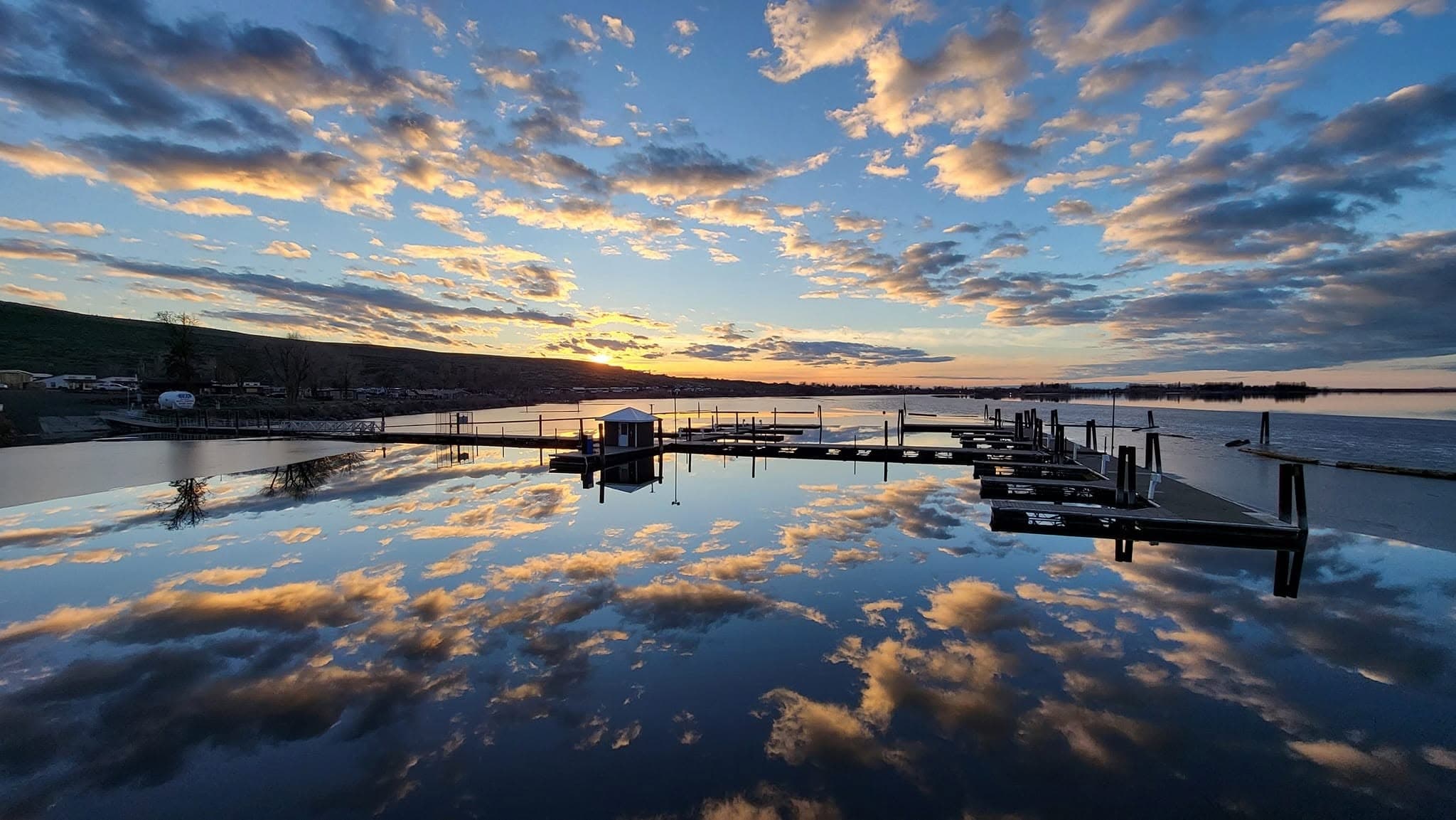 The MarDon Resort marina docks reflected at sunset on Potholes Reservoir
